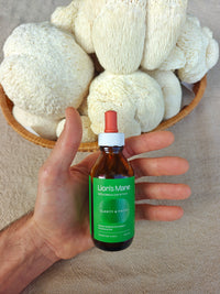 Hand holding Lion's Mane mushroom extract, Fleur de Fungi Coolum Beach